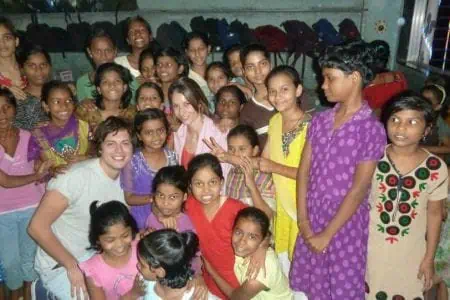 Darlo's Chloe and Jim with Project Crayon children