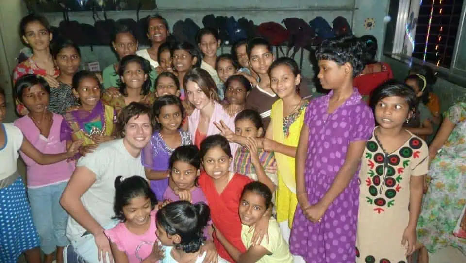 Darlo's Chloe and Jim with Project Crayon children
