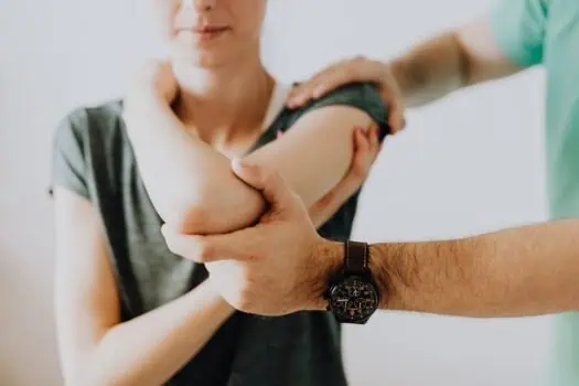 Relief and support through physiotherapy for shoulder pain, demonstrating a TENS therapy treatment for muscle recovery.