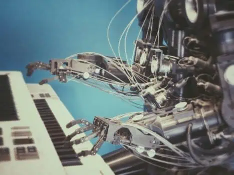 Robotic hand playing keyboard, artificial intelligence technology, advanced robotics, automation, human-machine interaction, futuristic innovation.
