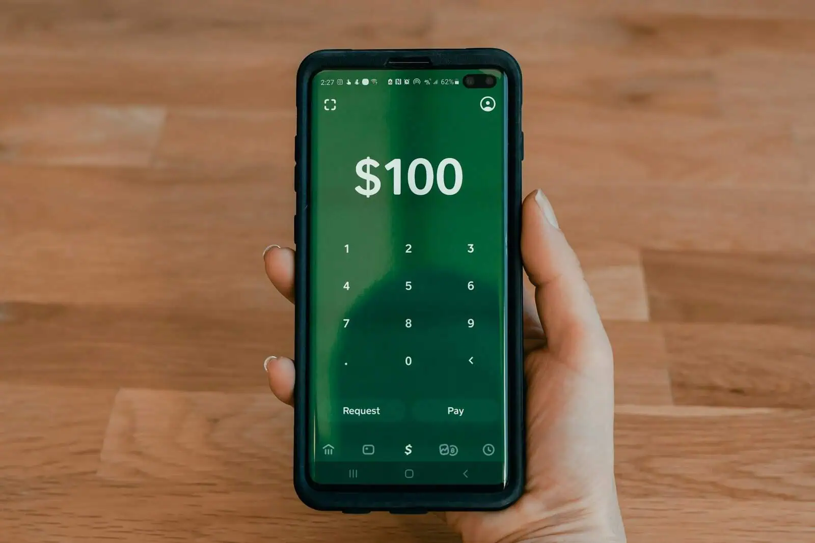 $100 digital money transfer on smartphone screen, mobile payment technology, online banking concept.