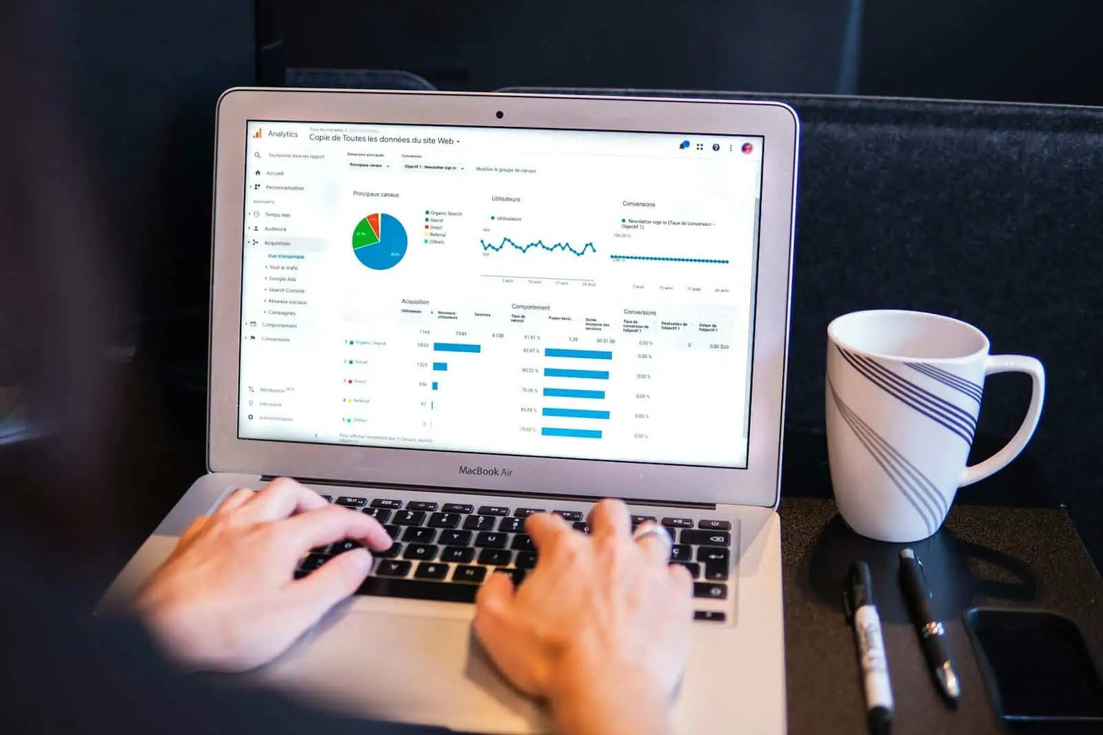 Analysis of website analytics data on a MacBook Air for digital marketing insights and SEO performance.