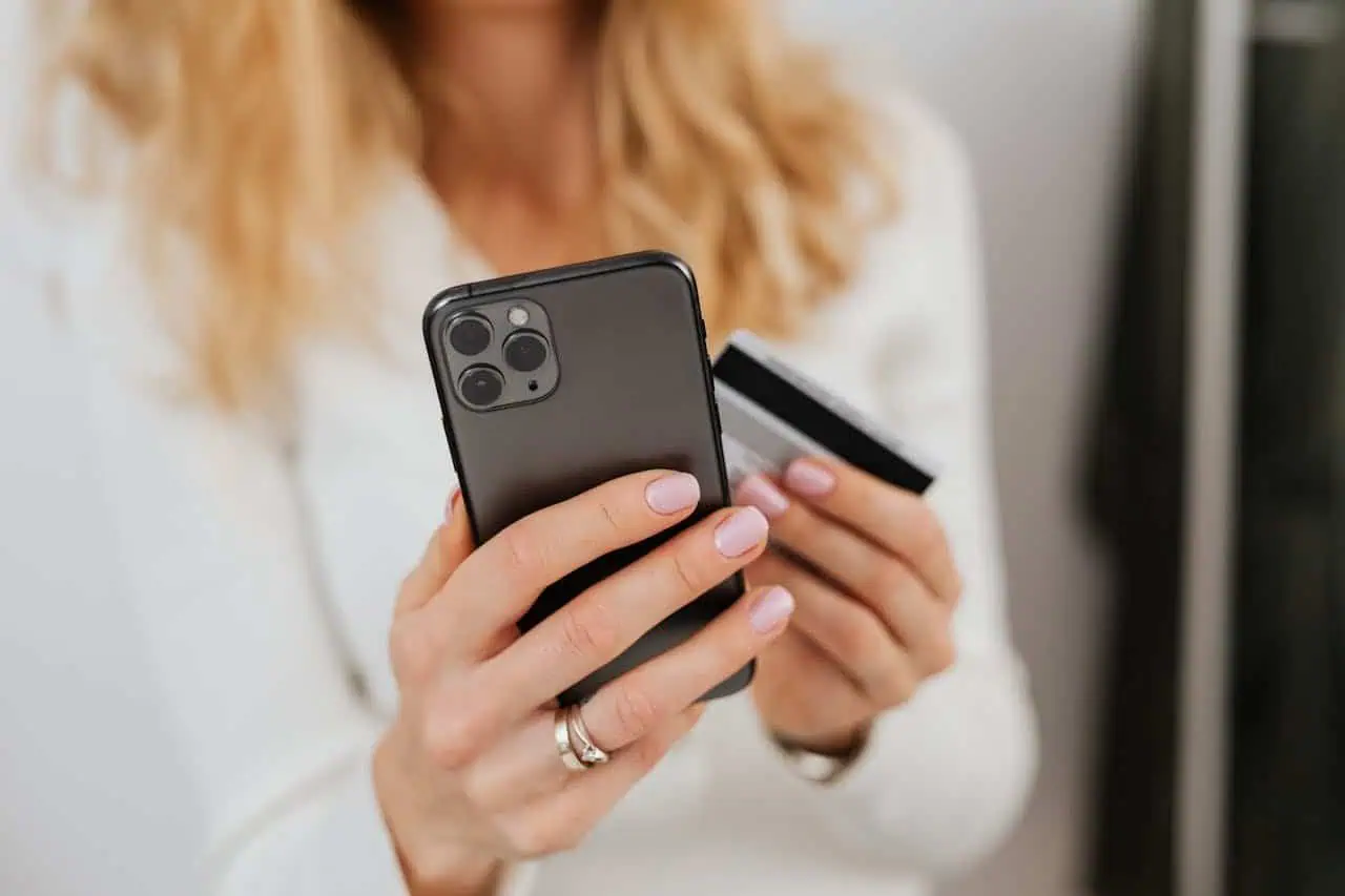 Smartphone and credit card use for online shopping or banking by women.