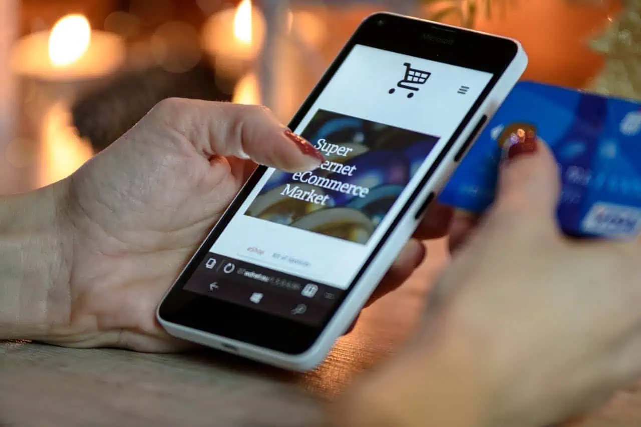 Mobile shopping for online grocery shopping on smartphone with credit card, e-commerce, digital payment, cashless transaction, grocery delivery, and supermarket shopping keywords.