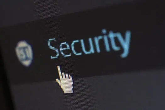 Secure online security and digital safety concept, close-up of a computer screen showing the word 'Security' with a hand cursor icon. Ideal for topics related to cybersecurity, protecting personal data, and online safety.