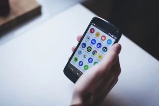 Mobile smartphone displaying various app icons, digital technology, mobile apps, communication tools, smartphone screen, modern tech, user interface.