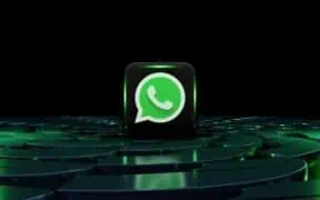 Green WhatsApp logo on a digital black cube with green accents, representing online communication and messaging apps.
