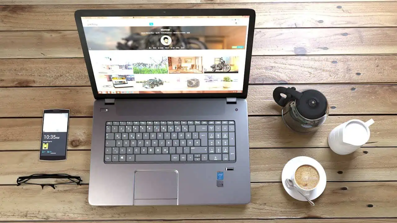 Laptop computer on wooden desk for online learning and career development.