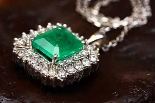 Emerald pendant with diamond halo on silver chain, luxury gemstone jewellery, fine art and accessories, elegance and sophistication, Prowess jewelry collection, high-quality craftsmanship.