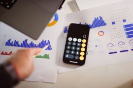 A table with A4 papers with graphs and data