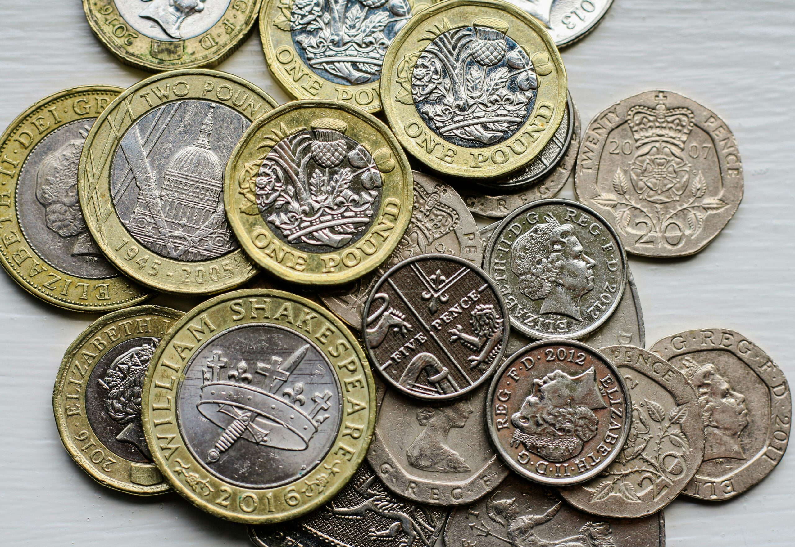 Multiple UK coins on the table