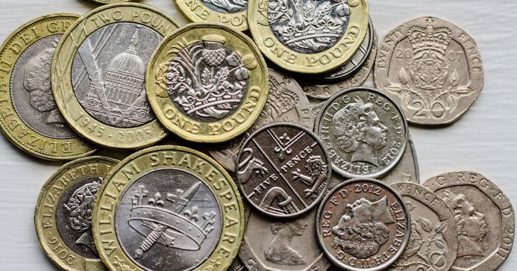 Make payments with UK Sterling, one pound coins, five pence pieces, twenty pence pieces.