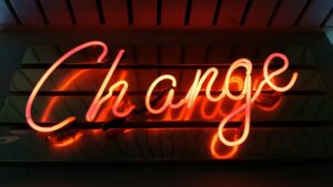 A red neon sign saying "change"