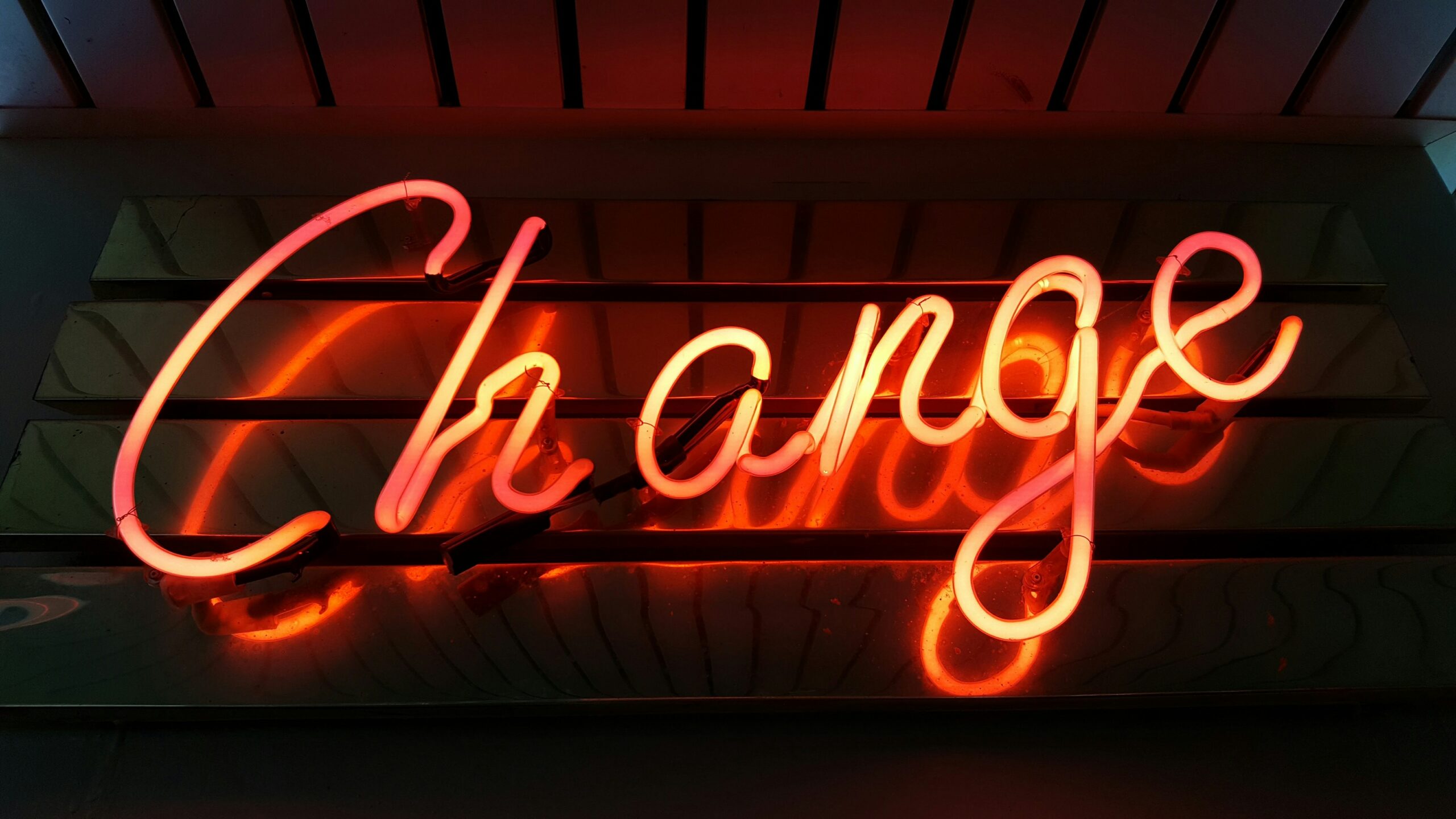 A red neon sign saying "change"