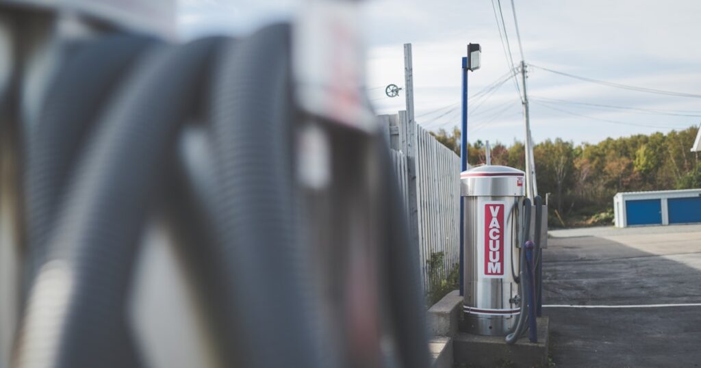 a gas station with a gas pump next to it