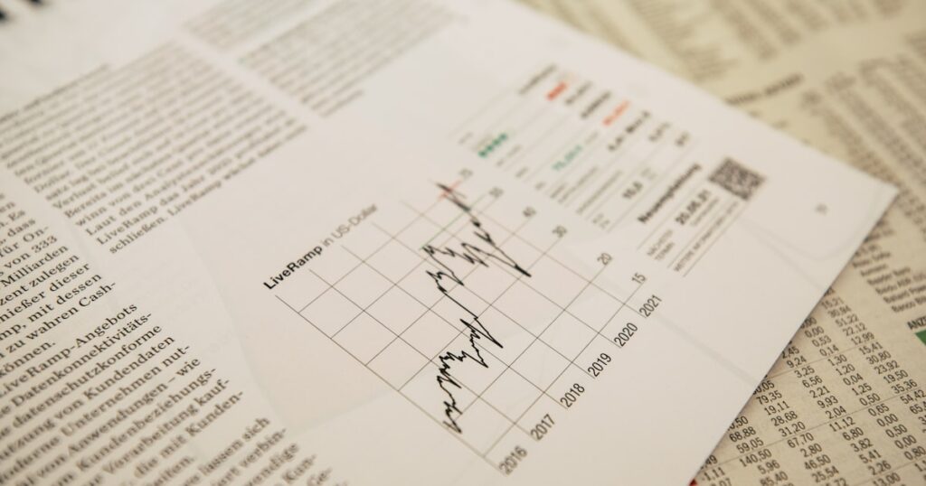 financial newspaper with stock chart