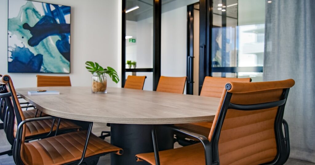 brown wooden 9-piece office table and chairs