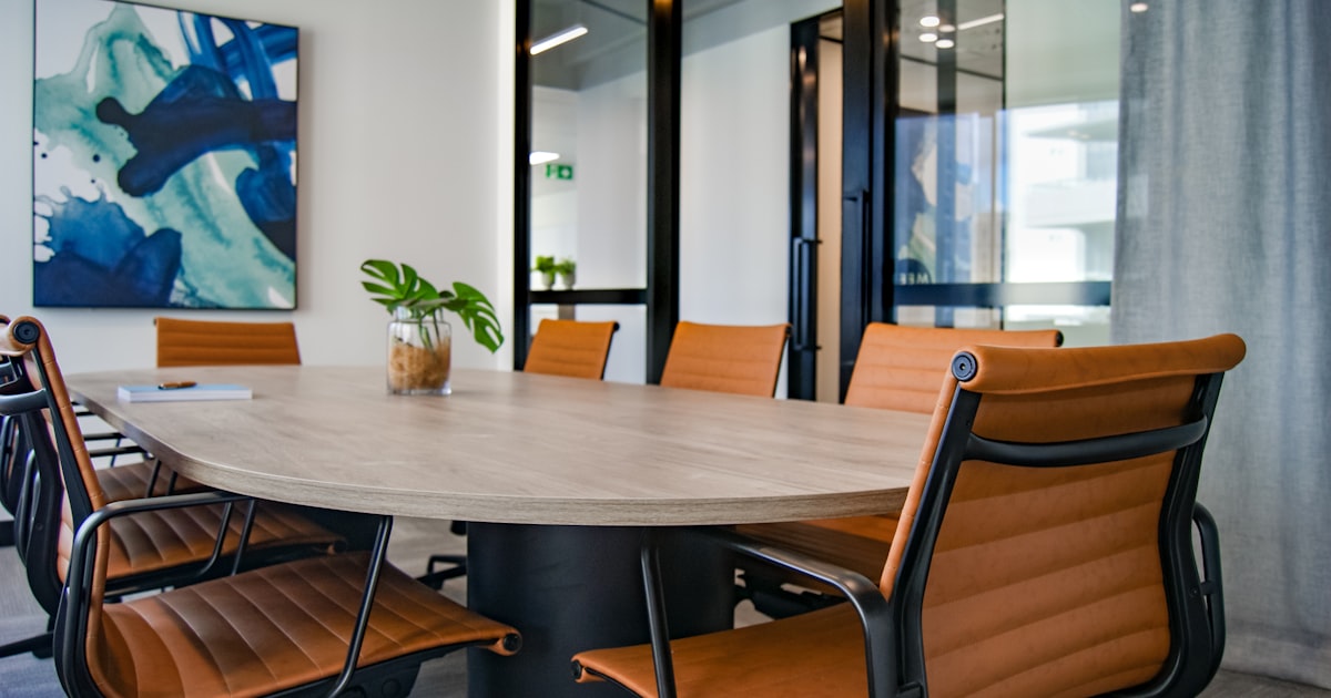 brown wooden 9-piece office table and chairs