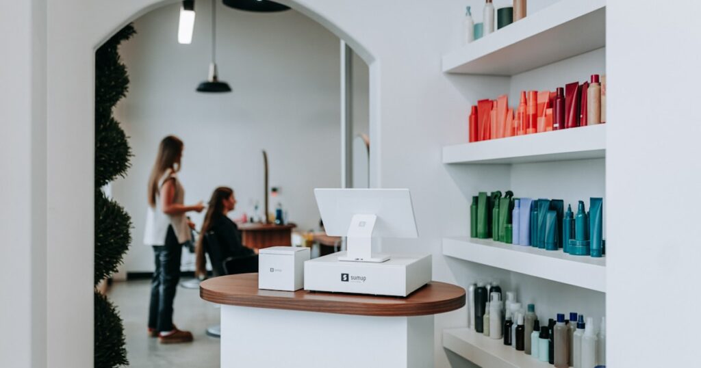 A hair salon interior with hair products and clients.