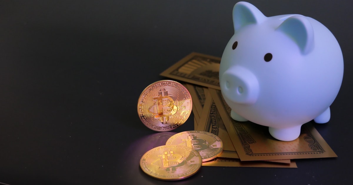 Piggy bank with coins and paper money.