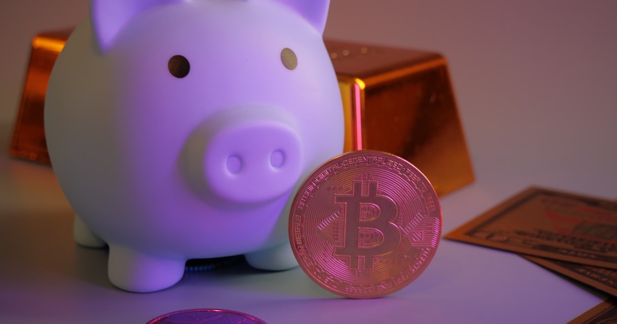 Piggy bank with bitcoin and gold bars