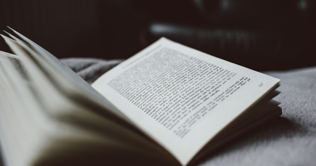 selective focus photography of opened textbook