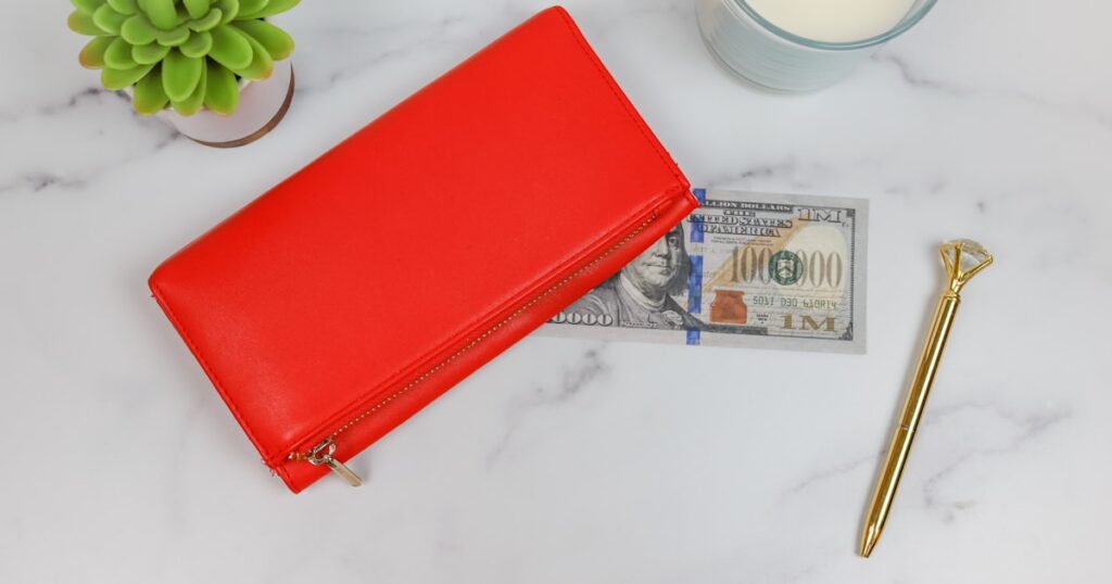 a red wallet and a key