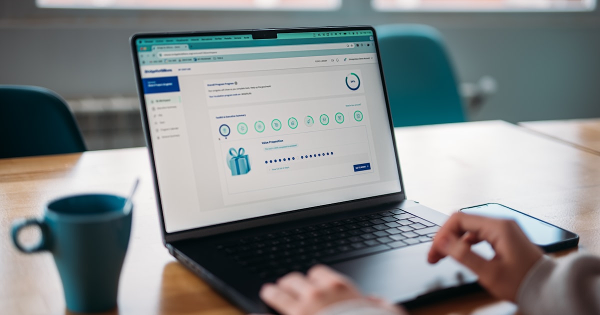 Person using a laptop to review a rewards program.