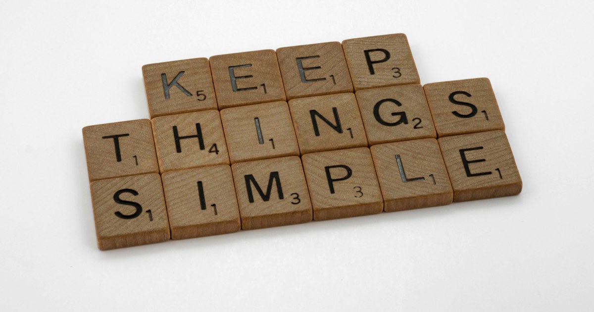scrabble, scrabble pieces, lettering, letters, wood, scrabble tiles, white background, words, quote, letters, type, typography, design, layout, focus, bokeh, blur, photography, images, image, keep things simple, simplify, complexity, clutter, muddle, clear thinking, problem solving, secret of success, kiss, keep it simple stupid, occam razor, occam,