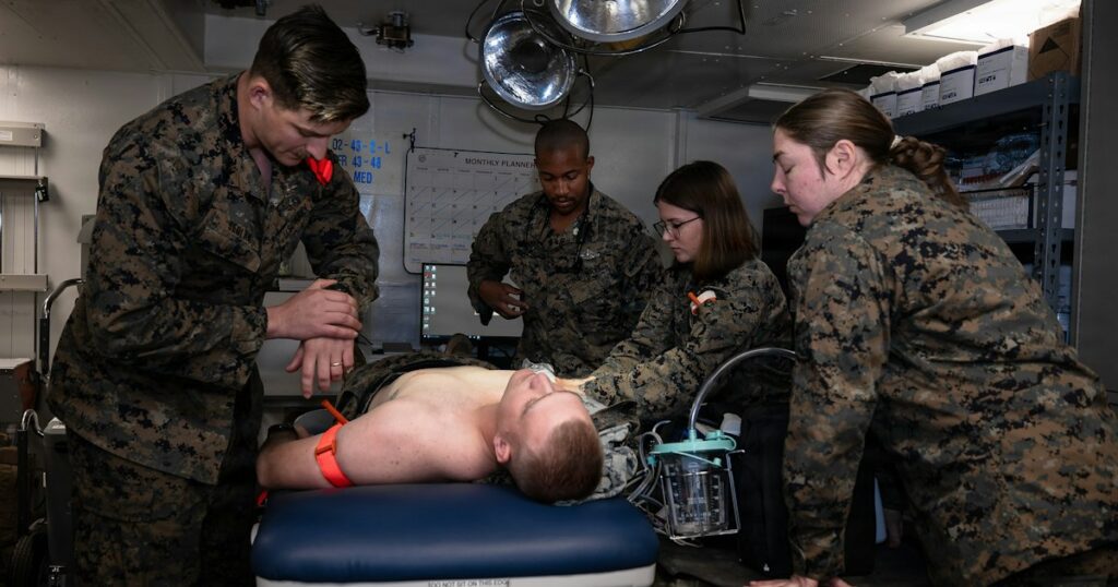 PACIFIC OCEAN (Jan. 26, 2026) - U.S. Navy hospital corpsmen assigned to Task Force Ashland, I Marine Expeditionary Force, triage a simulated casualty in an operating room during a mass casualty drill aboard the amphibious dock landing ship USS Ashland (LSD 48) off the California coast, Jan. 26, 2026. TF Ashland is a flexible, forward-deployed crisis response force led by the 15th Marine Expeditionary Unit. Purpose-built to integrate with allies and partners, TF Ashland supports a free and open Indo-Pacific by providing immediate response capabilities for any contingency. (U.S. Marine Corps photo by Sgt. Brian Knowles)
