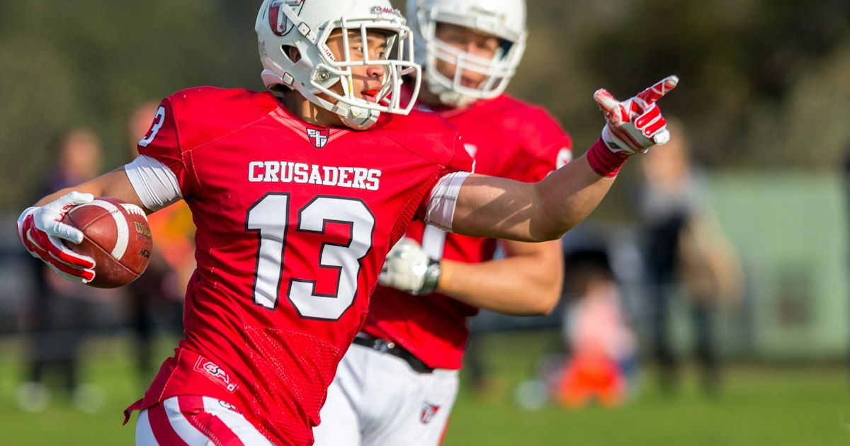 Gridiron Victoria: Americain Football Aristotle Hua from the Western Crusaders after a touchdown