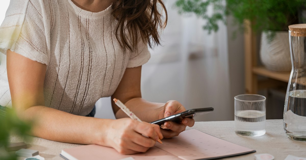 girl planing a week at home office in bright room