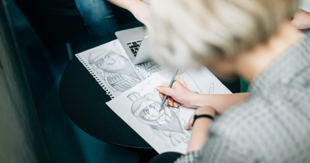 Female sketching on paper