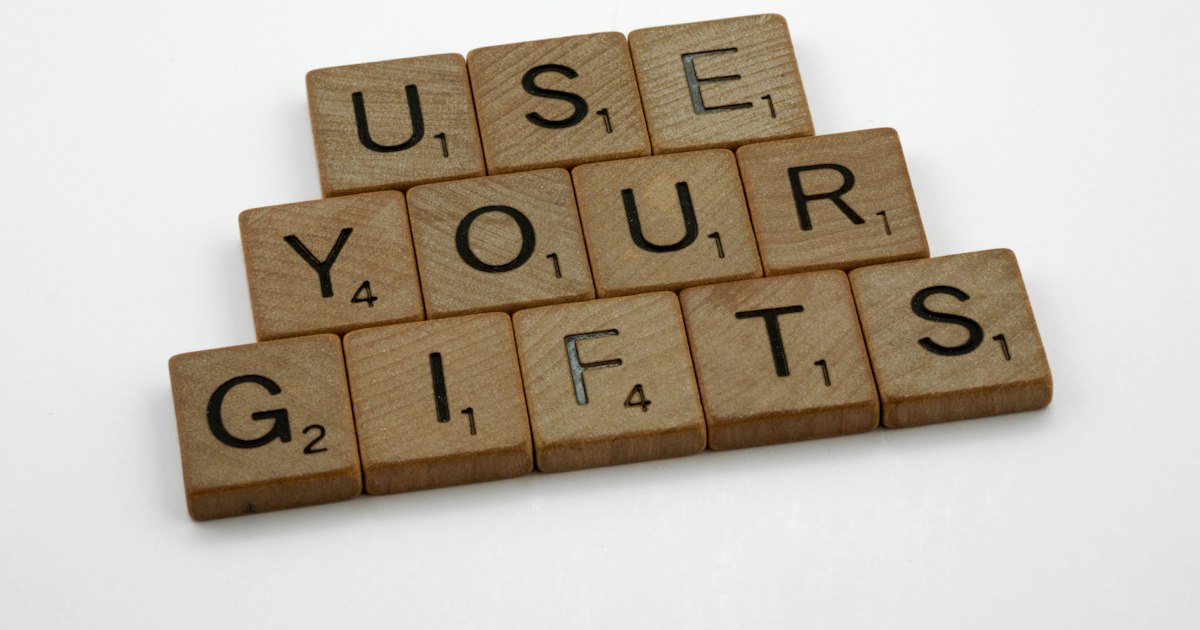 scrabble, scrabble pieces, lettering, letters, wood, scrabble tiles, white background, words, quote, letters, type, typography, design, layout, focus, bokeh, blur, photography, images, image, use your gifts, gifting, christian, st paul, paul, spiritual gift, charism, charismata, holy spirit, word of knowledge, faith, healing, miracle, prophecy, discernment, tongues, apostle, prophet, corinthians, romans, ephesians, 1 peter, serving, teaching, exhortation, encouragement, giving, leadership, mercy, love,