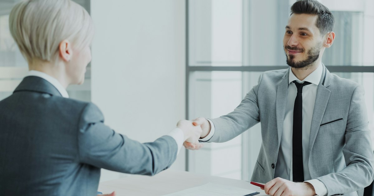 🎬 FULL 4K VIDEO for this still is in my bio link! ⬇️ HR male manager shaking hand to female candidate after having job interview in modern office indoors